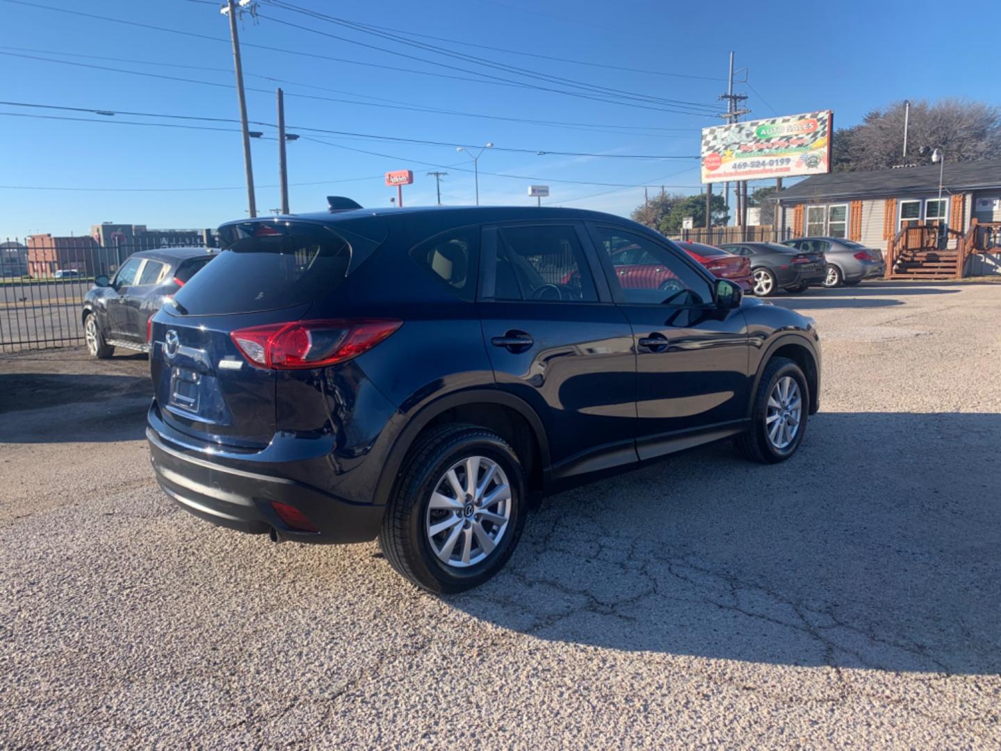 2014 Blue /Tan Mazda CX-5 Touring (JM3KE2CY1E0) with an 2.5L L4 DOHC 16V engine, Automatic transmission, located at 1830 North Belt Line Road, Irving, TX, 75061, (469) 524-0199, 32.834373, -96.993584 - Photo#2